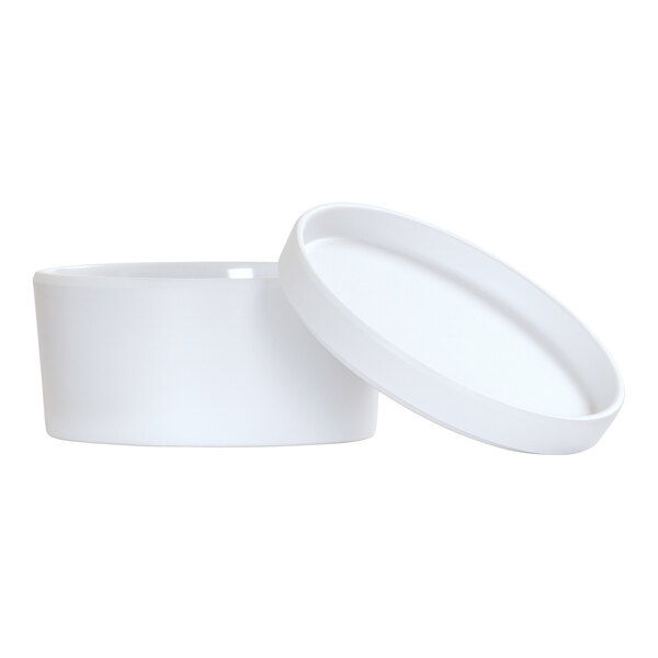 A white round Cal-Mil melamine bento box with a lid.