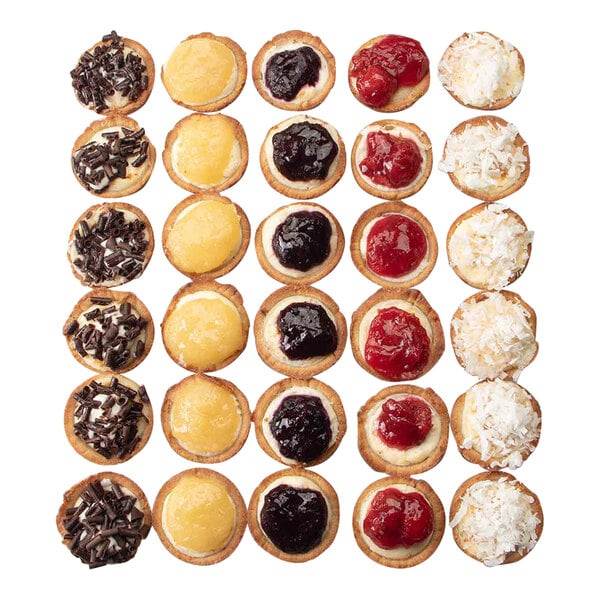 A group of mini assorted cheesecakes on a square platter.