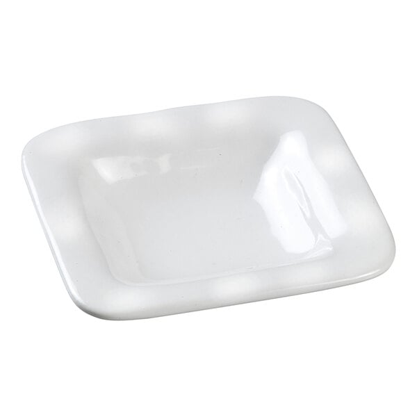 A white square Solia porcelain mini dish.