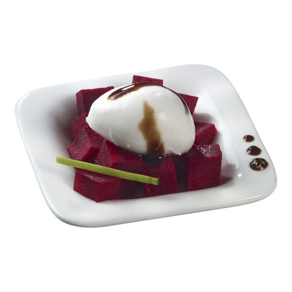 A white square Solia porcelain mini dish with a scoop of ice cream on top.