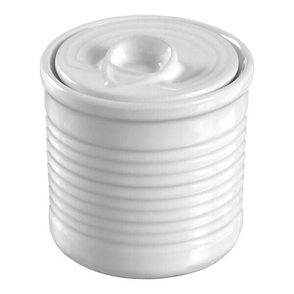 A white porcelain Solia tin can ramekin with a lid.