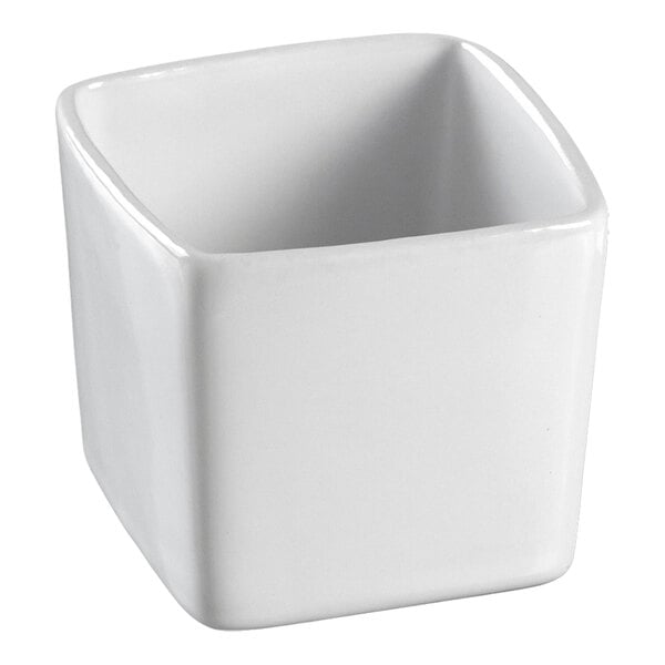 A close-up of a white square Solia porcelain mini dish.