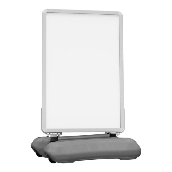 A white Plasticade Wind Sign II with a black snap frame on a grey stand.