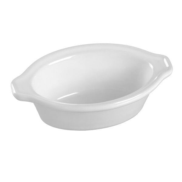 A white oval Solia porcelain mini dish with a handle.