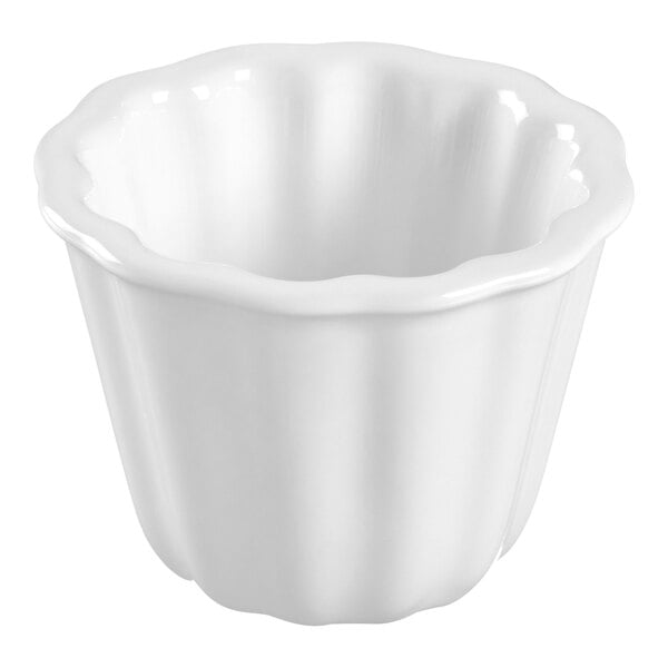 A Solia white porcelain mini dish with a scalloped edge.