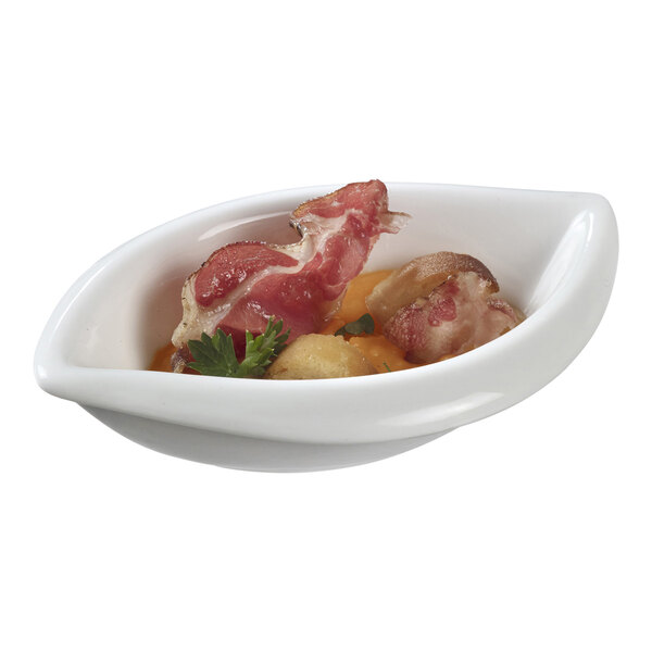 A Solia white porcelain mini dish filled with food containing bacon, meat, and vegetables.