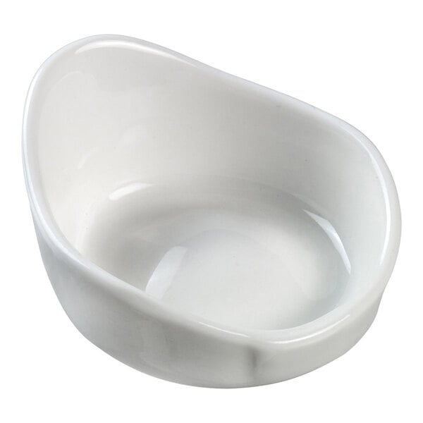 A Solia white porcelain mini dish with a small hole in the bottom.