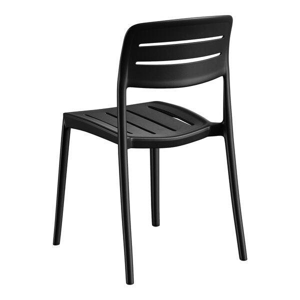 A black resin side chair with a slatted back and seat.
