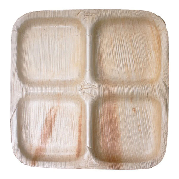 A close-up of a VerTerra square palm leaf plate with four compartments.