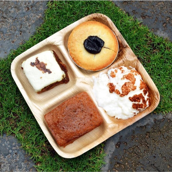 A VerTerra 4-compartment plate with four different desserts on it.