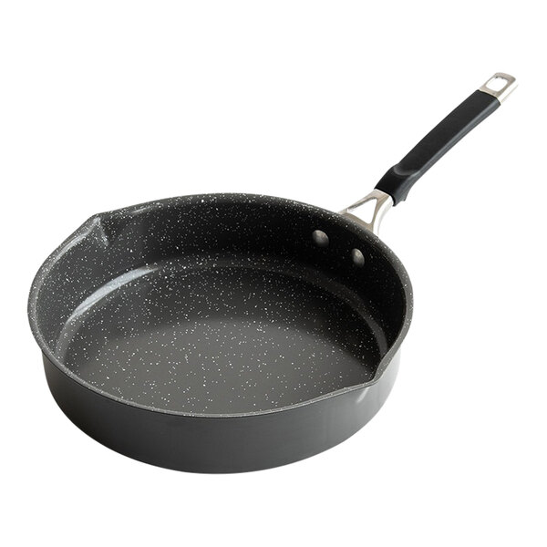 A black saute pan with a speckled surface and silver handle.