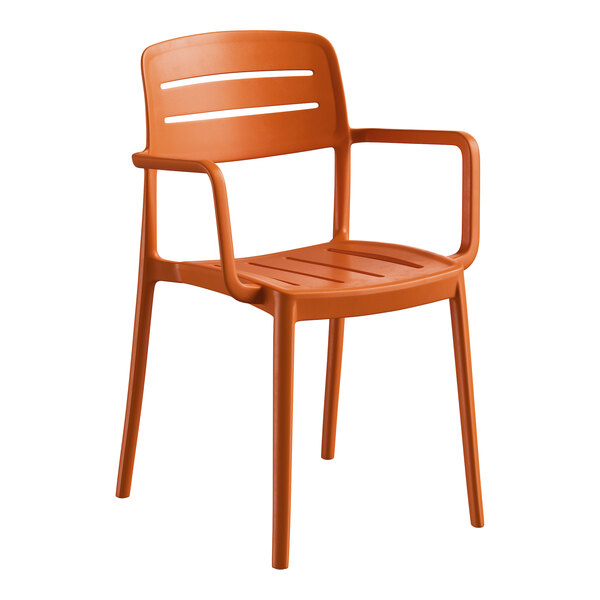 A terracotta-colored resin arm chair with a slat back design.