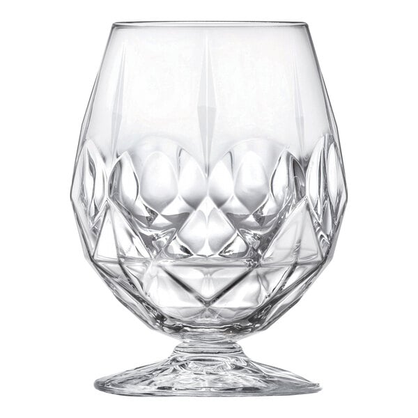 A clear, faceted 17.75 oz. brandy glass with a wide bowl and short stem.