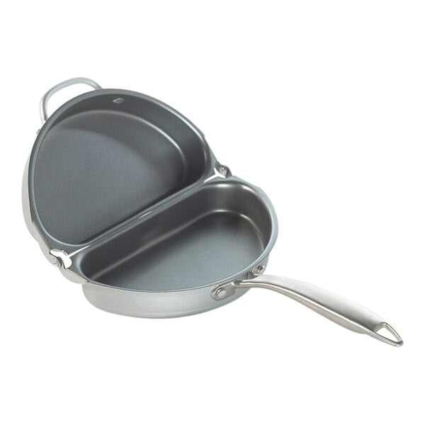 A Nordic Ware aluminum folding frittata/omelet pan with a lid and a handle.
