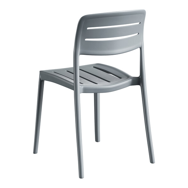 A gray resin side chair with a slatted back and seat design.
