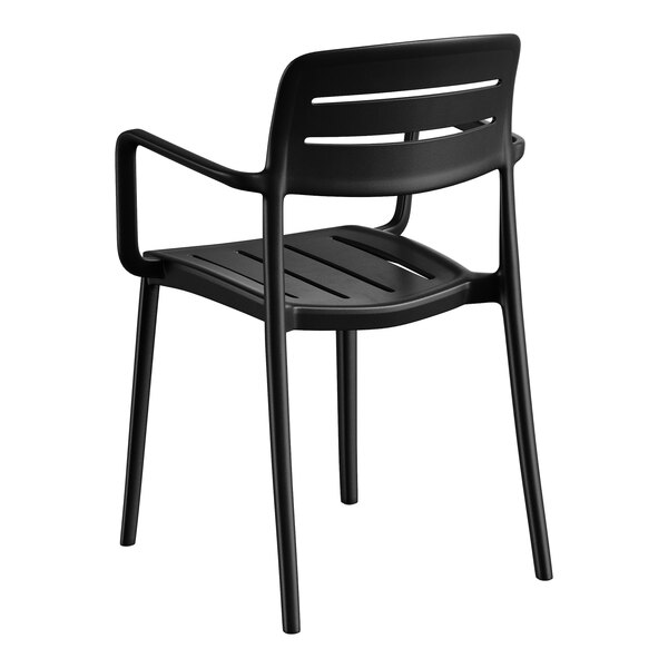 A black resin arm chair with a slatted back and seat design.