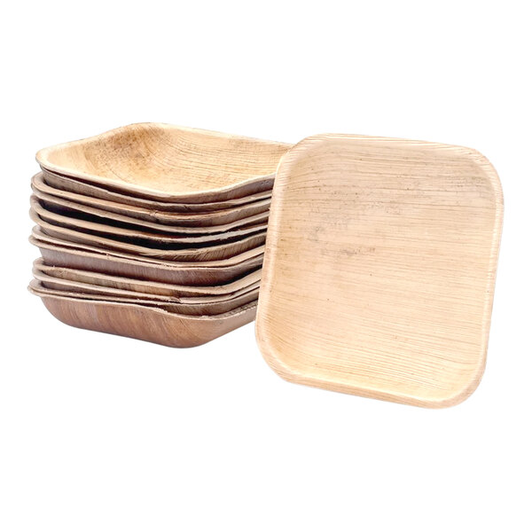 A stack of VerTerra round palm leaf bowls.