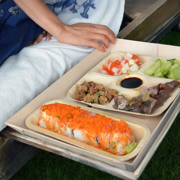 A VerTerra 5-compartment plate filled with food on a wooden table.
