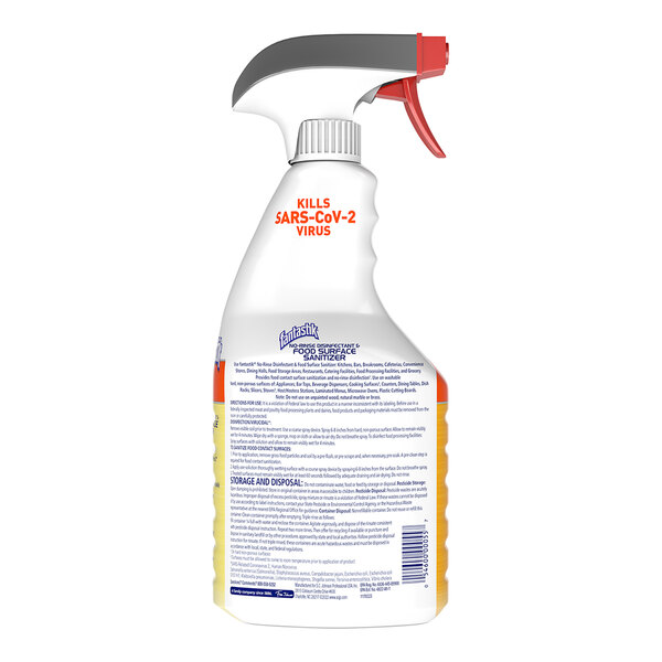 A close-up of a SC Johnson Fantastik spray bottle with a red and white label.