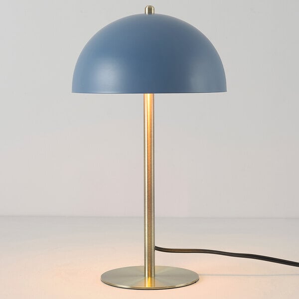 A 15-inch desk lamp with a matte blue dome-shaped shade and matte brass accents.