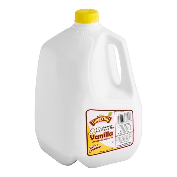 A red and white jug of Turkey Hill Premium Vanilla Soft Serve Ice Cream Mix.