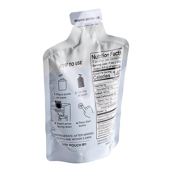 A white Numilk Barista Oat Milk Concentrate pouch with black text and instructions on it.