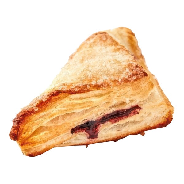 A blueberry turnover pastry with jam on top.