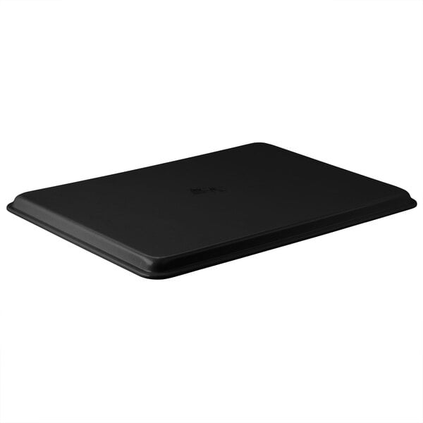 A black rectangular MFG Tray on a table.