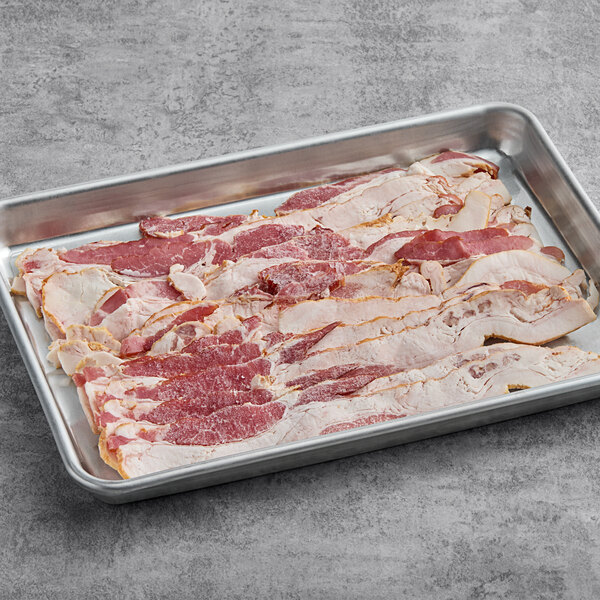 A tray of Hatfield Chef Choice applewood smoked bacon slices on a gray surface.