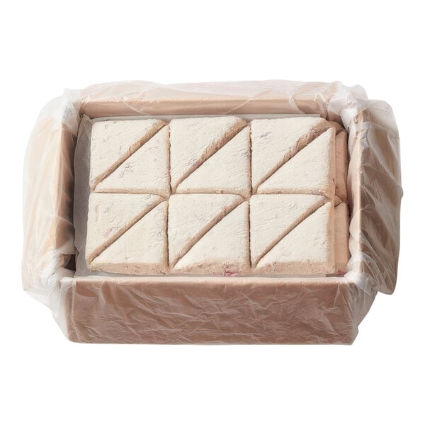 A box of Pillsbury Place & Bake Cranberry Orange Scone Dough in plastic wrap with square scones inside.