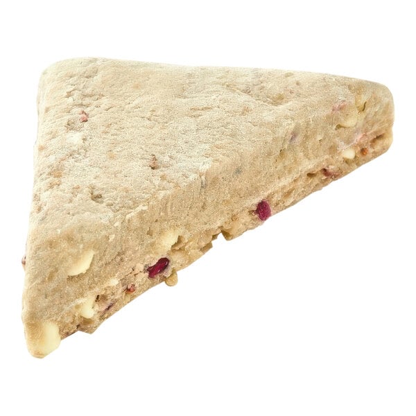 A triangular piece of Pillsbury raspberry white chunk scone with white chocolate and fruit.