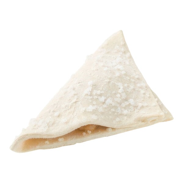 A sugared apple turnover with a white surface.