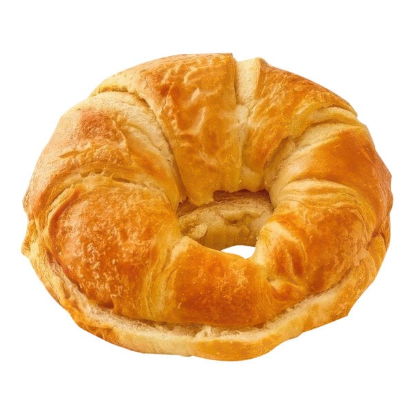 Sliced croissant pinched closed.