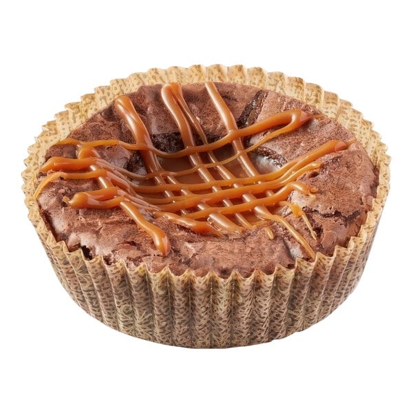 A Pillsbury Chocolate Ganache brownie single serve cup with caramel drizzle on top.