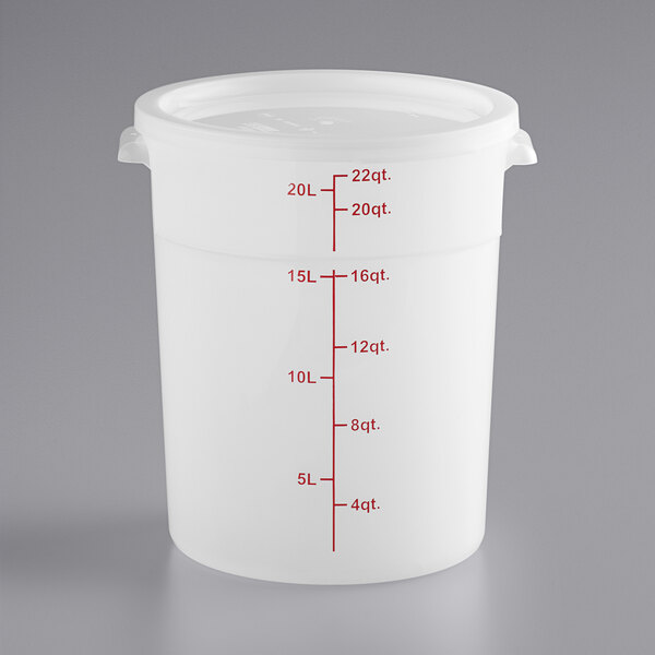 A large translucent round polypropylene food storage container with a lid and red measurement markings up to 22 quarts.