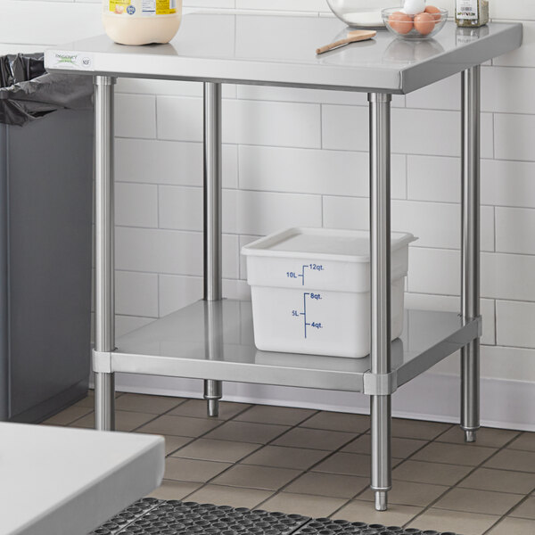 An adjustable stainless steel undershelf designed for 30-inch by 30-inch work tables.