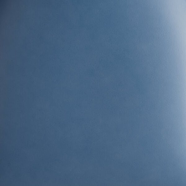 A navy blue surface with white spots.