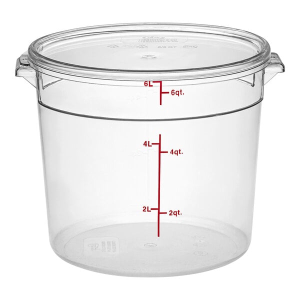 A clear round polycarbonate food storage container with a lid and measurement markings up to 6 quarts or 6 liters.