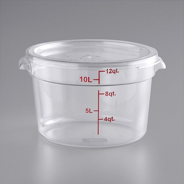 A clear round polycarbonate food storage container with a lid and red measurement markings up to 12 quarts or 10 liters.