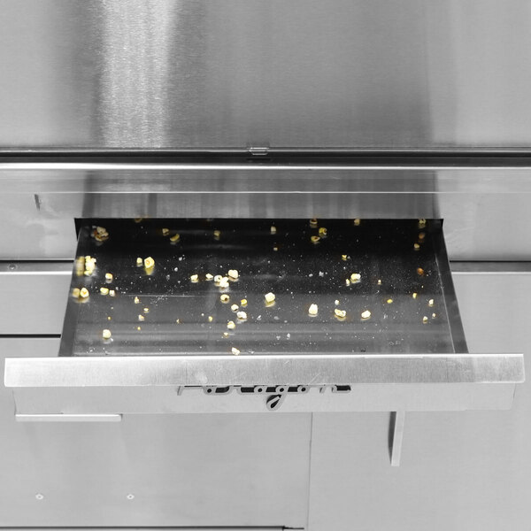 A Paragon Zenith countertop popcorn machine with fresh popcorn.