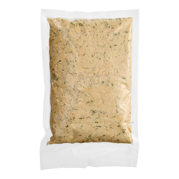 A plastic bag of Jinka plant-based vegan lemon and dill tuna with a green label.