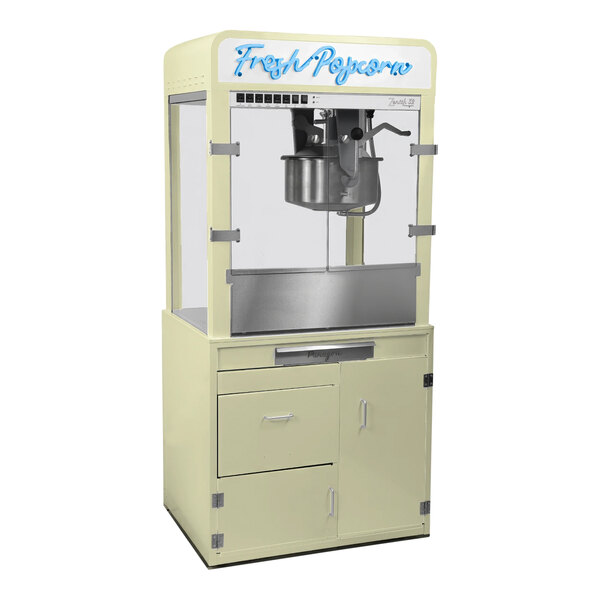 A Paragon cream popcorn machine on a metal cabinet with a glass front.