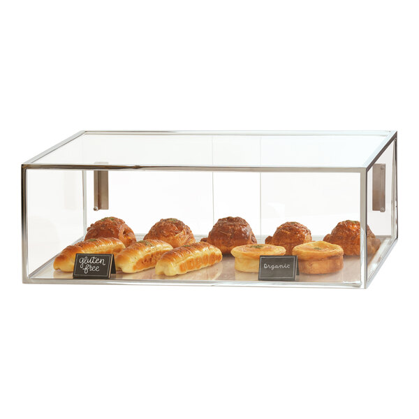 A Cal-Mil chrome bakery display case filled with pastries.