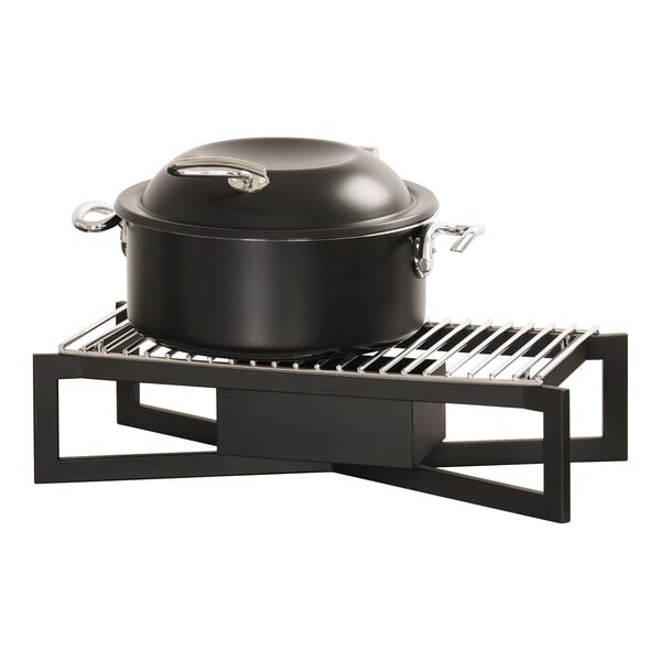 A black pot on a metal rack.