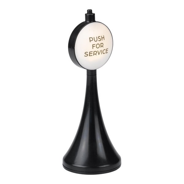 A black and white plastic tabletop sign that says "Push for Service"