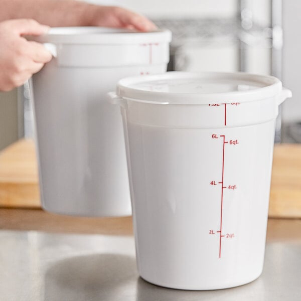 A white round 8-quart polypropylene food storage container with a lid and red measurement markings.