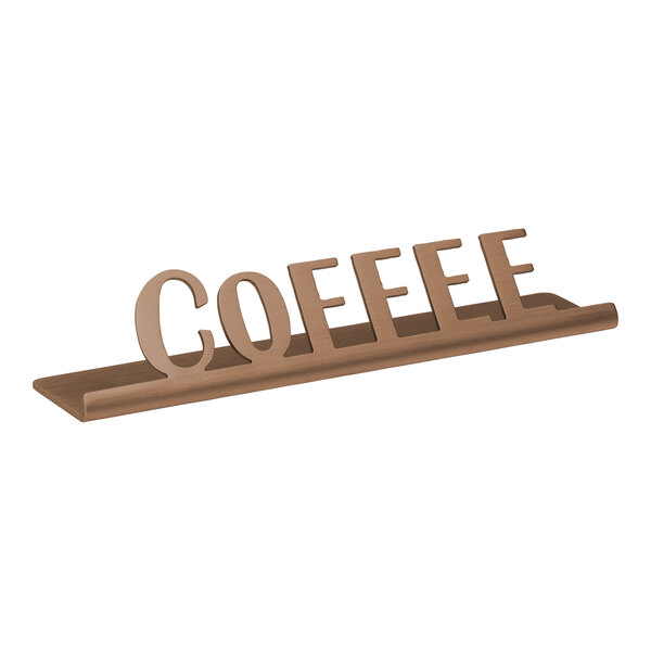 A rose gold stainless steel Tabletop sign that says "Coffee" on a table.