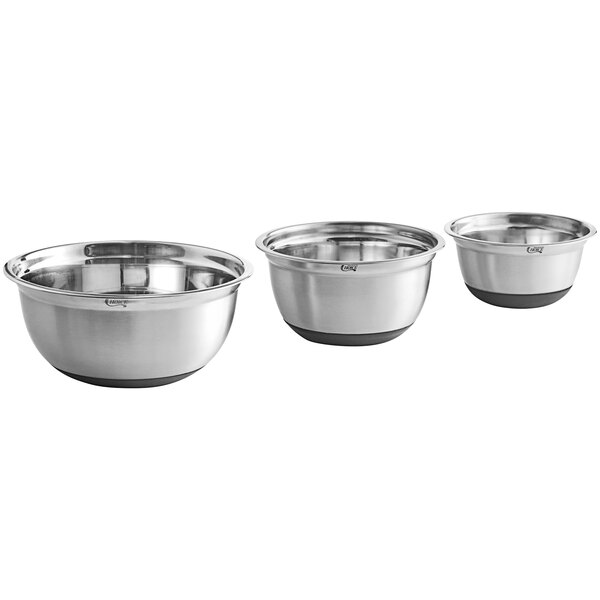 A set of three stainless steel mixing bowls with silicone bottoms in varying sizes.