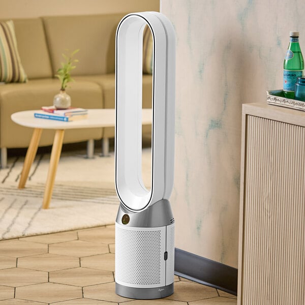 A white Dyson Purifying Fan sitting in a room.