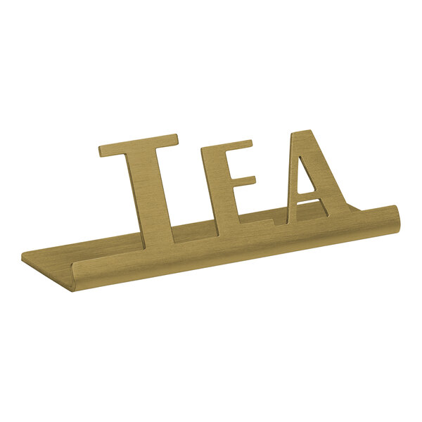 A vintage gold stainless steel "Tea" tabletop sign in a wooden stand.